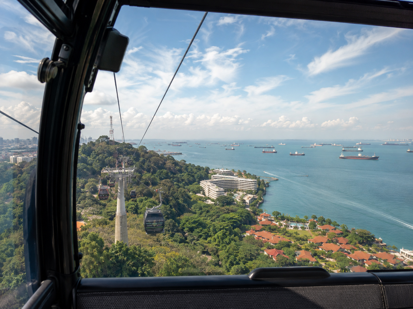 Singapore Cable Car — aerial view from gondola of the Singapore Strait, Sentosa, and Mount Faber
